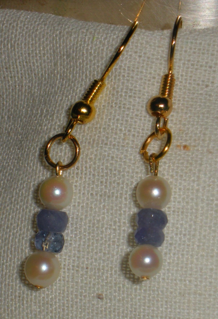 Cultured pearl and tanzanite.