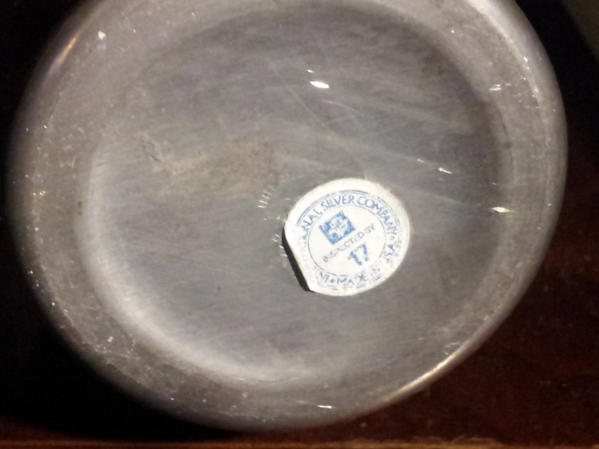 The maker's mark and original label on the bottom of the pitcher.  Made in CT.