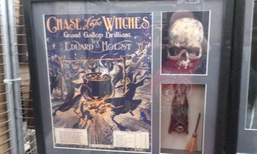 That's sheet music framed on the left hand side there.  And under the skull?  A bat.