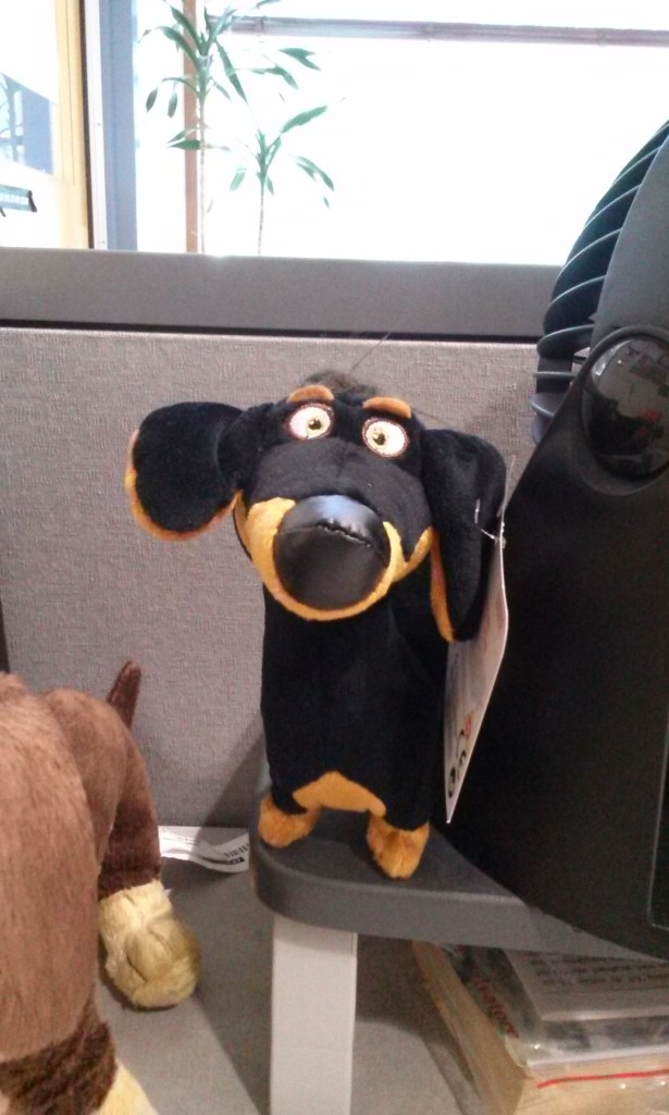 Yes, it's a small black and tan stuffed dachshund.